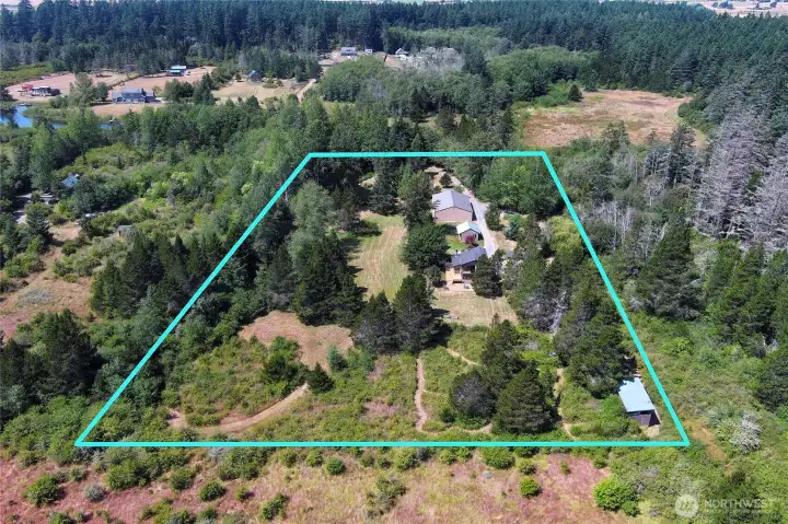 Drone view of the 5+ acres, fully fenced property.