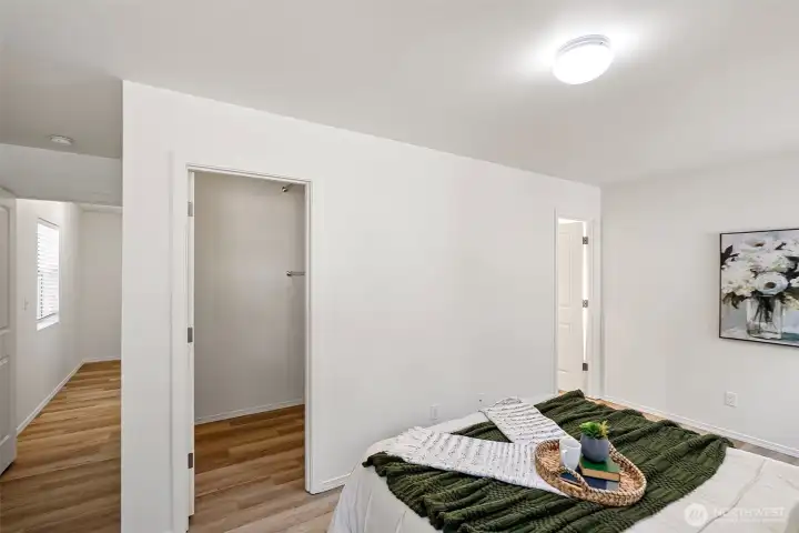 Primary bedroom with walk-in closet