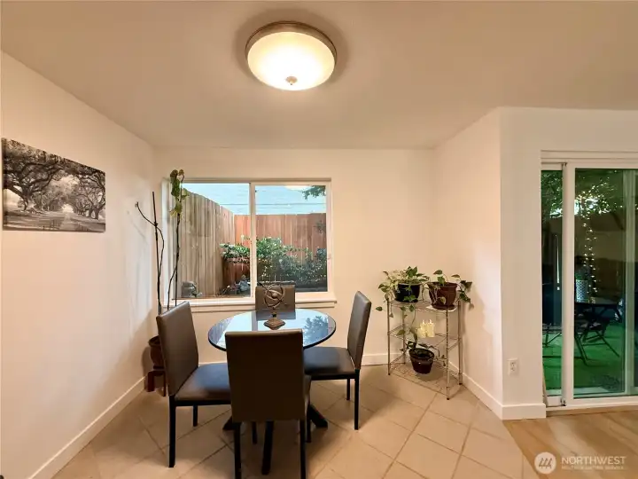 From the kitchen, another view of the dining area, and the slider opens to backyard.
