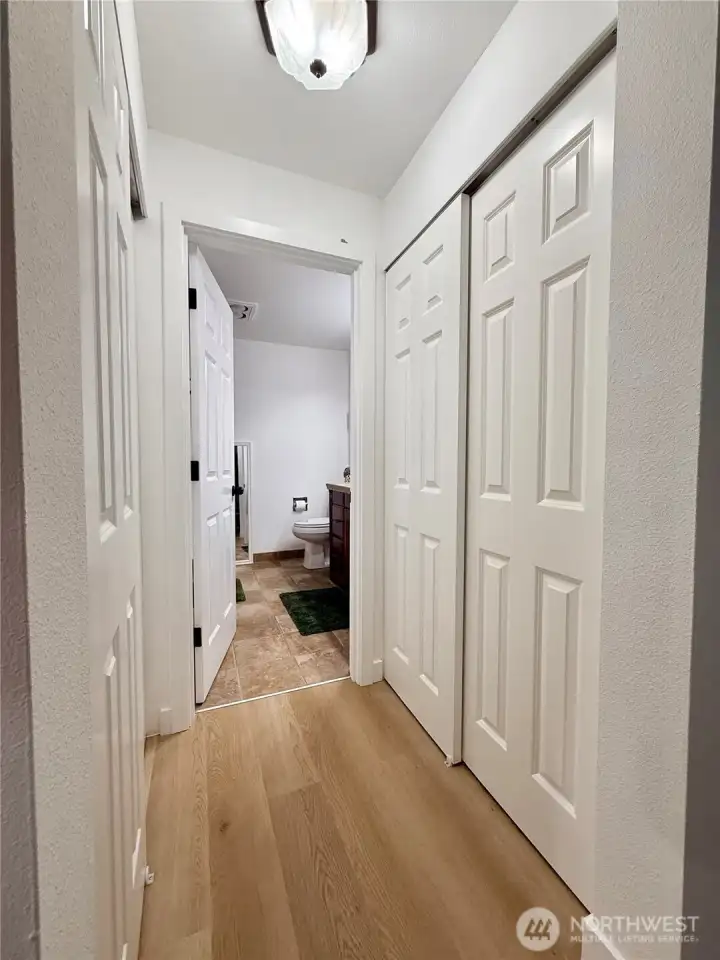 Double closets in the primary bedroom, leading to the primary bathroom.