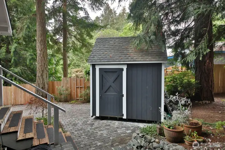 Newer garden shed! Please note the iron shovel art piece on the front of the shed does not convey. Garden art and potted plants do not convey as well.