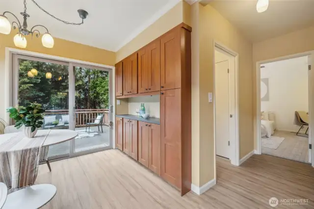Kitchen with eating space and easy access to deck! Lots more storage in this cabinetry.