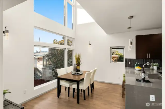 Two story high windows in kitchen and dining room