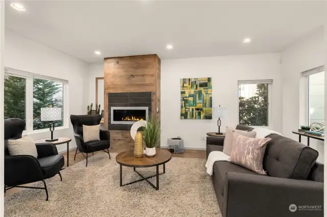 Open living room with cozy gas fireplace.