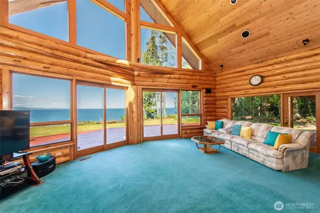 There are 2 double wood framed patio doors in living room, one in family room, and both upper primaries.