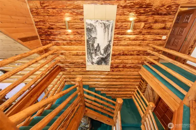 Beautiful stairwell and wall hanging.