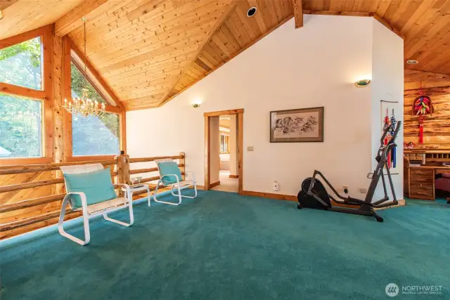 Loft area to West Primary Bed room. Beautiful office area in loft.  Enjoy the saltwater view while working out.