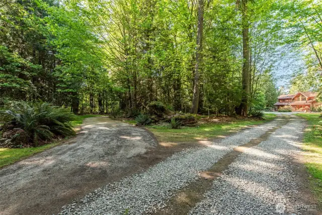 Left of driveway is road to beach.