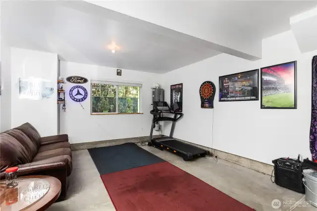 Oversized 2-car tandem garage can fit two cars or one car plus "man cave/gym."