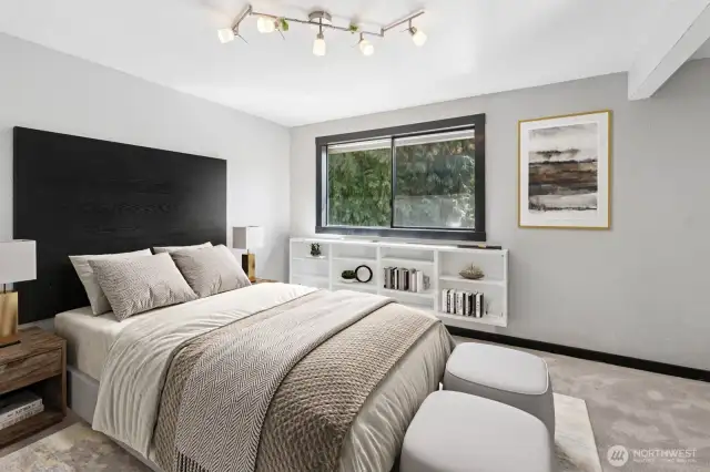 A generous primary suite with ensuite bath. This photo is virtually staged.