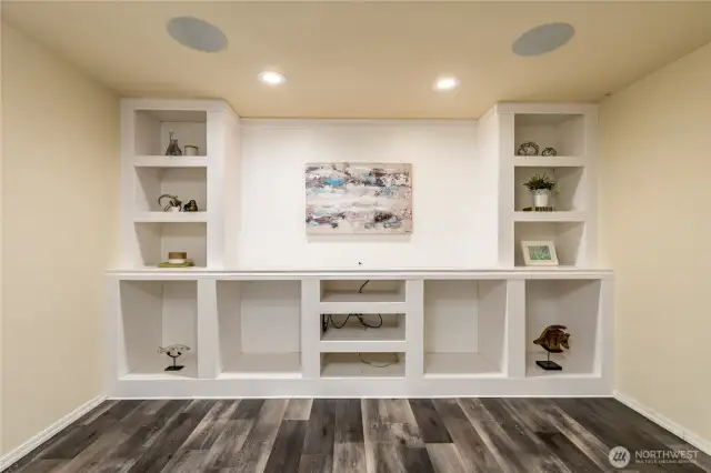 Built-in shelving and surround sound speaker system