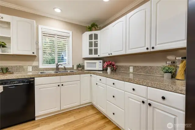 Spacious kitchen with crisp white cabinetry