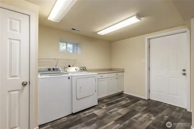 Laundry room with exterior door