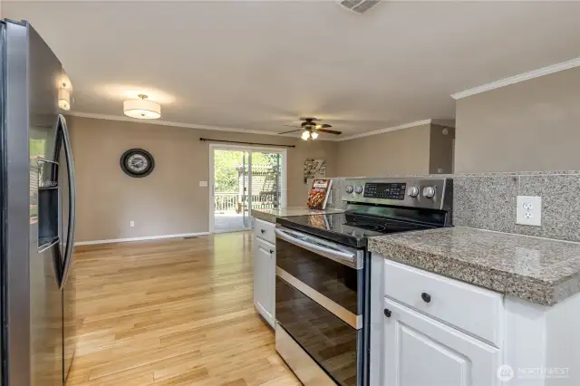 Kitchen overlooks dining and living rooms