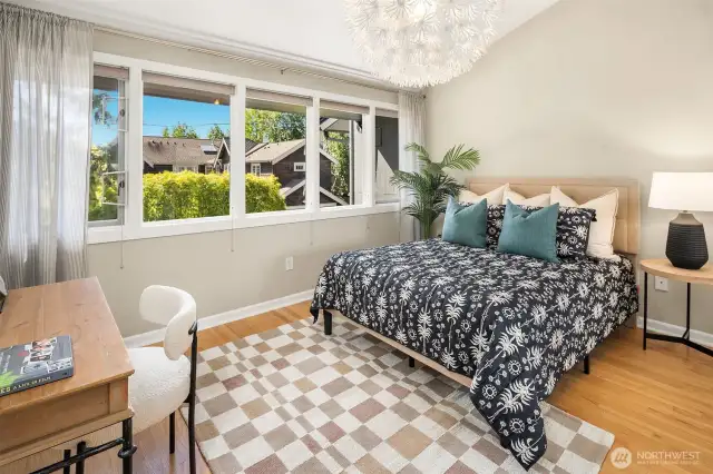 2nd bedoom or office with vaulted ceilings and light-filled windows,