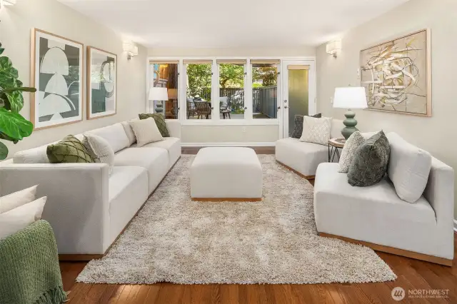 Wall of windows bring outdoor color and natural light inside.