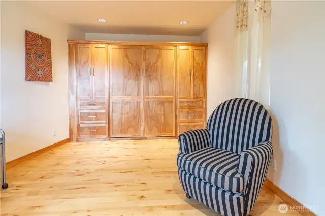 1221. This space features built-in cabinets and a Murphy bed, making it versatile as a guest room, second bedroom, or office—it's your choice!