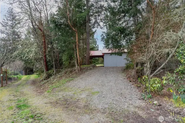 1291. Driveway leading to the pole building. The easement road is on the left.