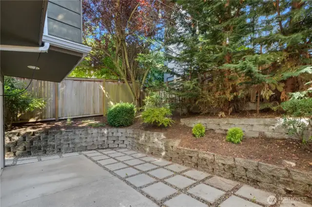 Wonderful backyard with fence, retaining wall, mature landscaping and privacy.