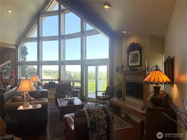The Great Room has 15 windows looking out at the Pacific Ocean. Propane fireplace adds warmth and coziness. Ceilings lights throughout the home all with rheostat controlled. Ceiling fan is the peak of the 25ft ceiling. Not shown.