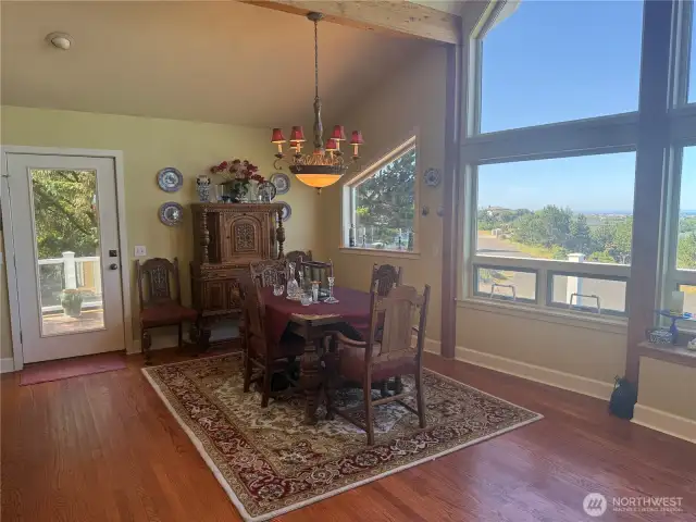 Dining with views of the Ocean as seen in the living room area as well.