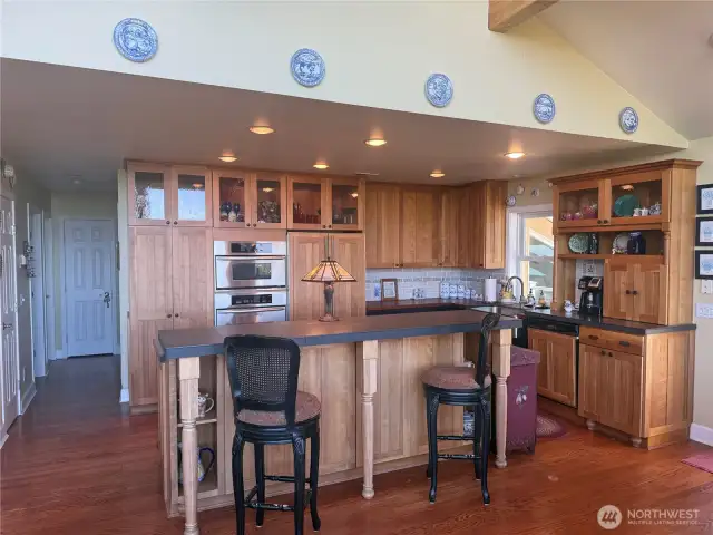 Kitchen shares the same ocean view. Convenient bar to have a quick snack or entertainment. All cherry cabinets. Bar has hidden storage underneath.