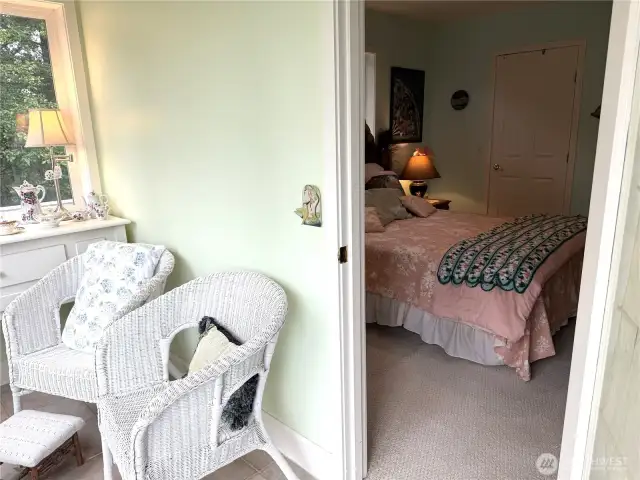 2nd bedroom access. The sun porch has sliding glass doors to the deck. This room is surrounded by windows.