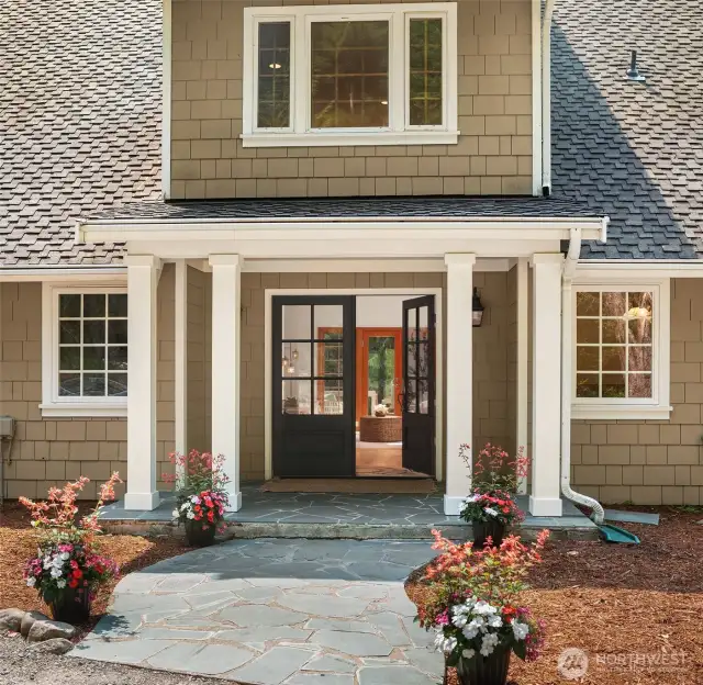 The formal front entrance makes you feel like you are entering your private mountain resort with unique columns, slate sidewalk and french doors.