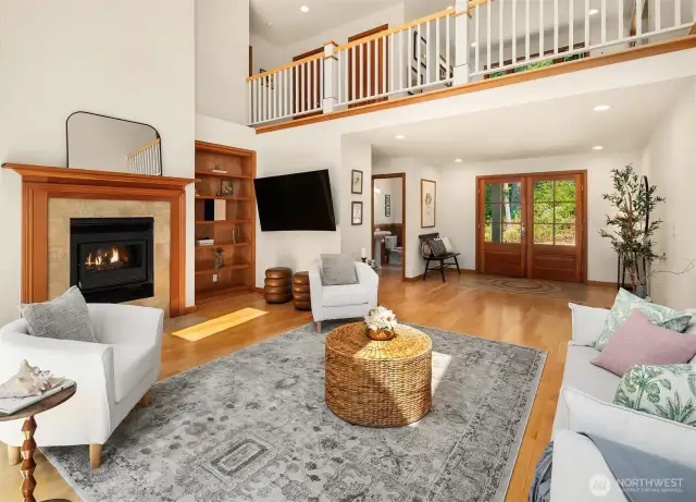The second level overlooks the spacious living room. A powder room sits just off the LR, as you head to your office.