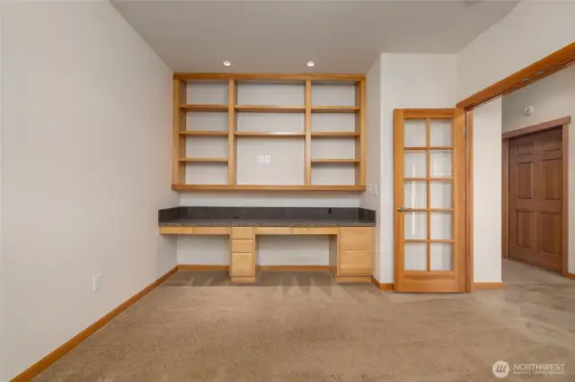 Front Guest Bedroom/Den/Office Area offers built-in office desk with granite countertop. Built-in shelving for your library too!