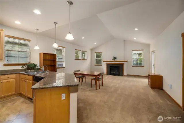 Open bright great-room style floorplan with vaulted ceilings.