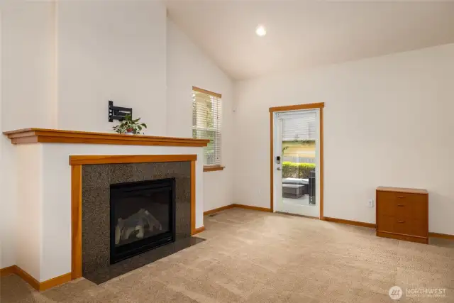 Cozy center gas fireplace with wood mantel