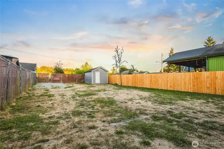 Oversized yard with one side having new fencing