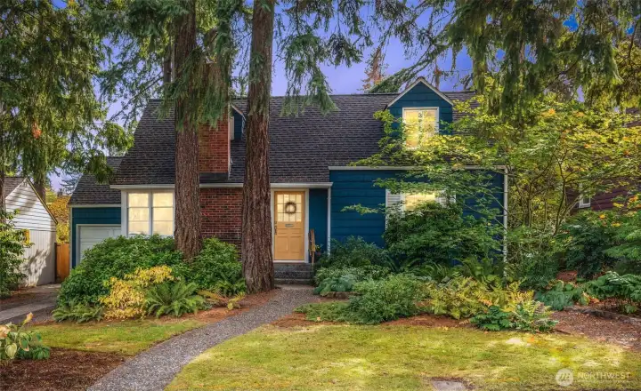 Storybook Cape Cod charm with classic dormers and timeless curb appeal.