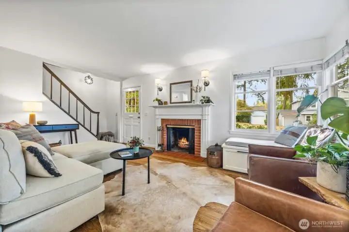 Classic wood-burning fireplace and endless Cape Cod charm floods this Wedgwood home.