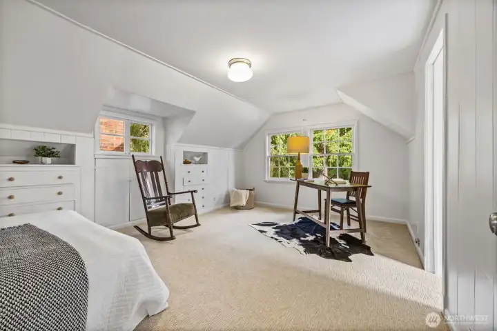 One of two upper floor bedrooms with all new carpet and charming built-ins.