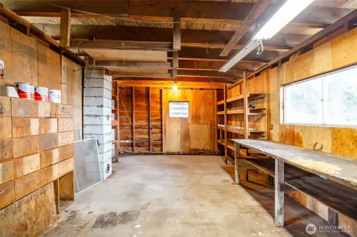 Incredible shop space with power, workbench and shelving. Perfect for hobbies, woodworking or tinkering!