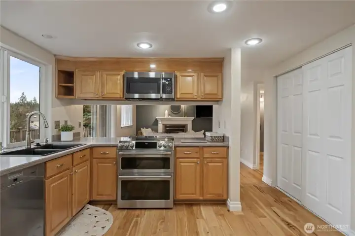 Induction cooktop and double oven, perfect for those larger gatherings. Optional bar seating or serving area.