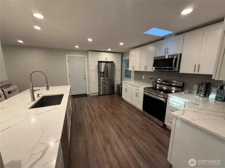 All new Kitchen with shaker cabinets and quartz counters.