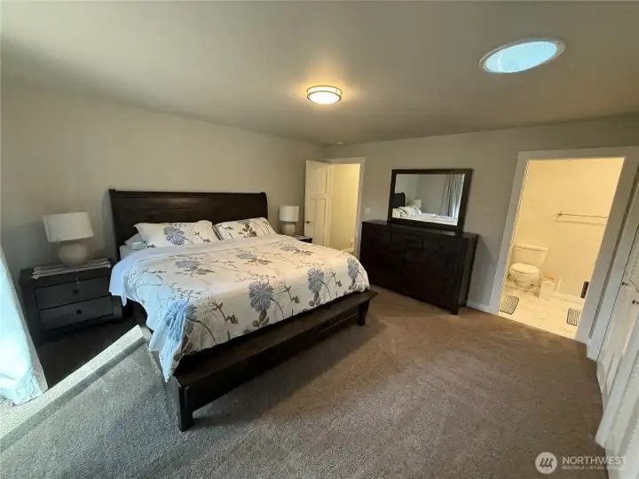 A wall of closet and outside entry to the  patio.
