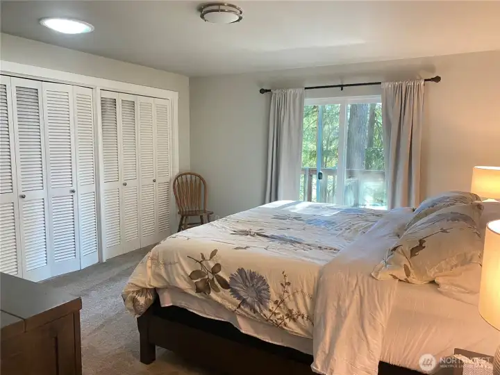 A wall of closet and outside entry ti patio.