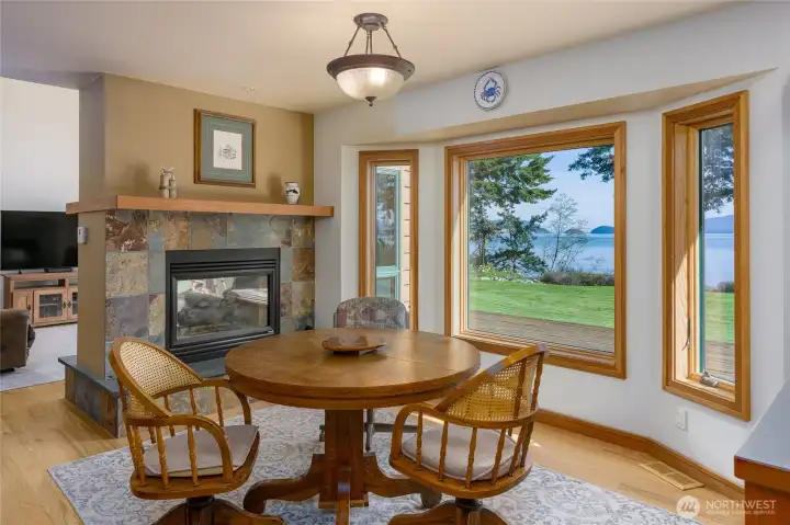 Eating area shares the fireplace.