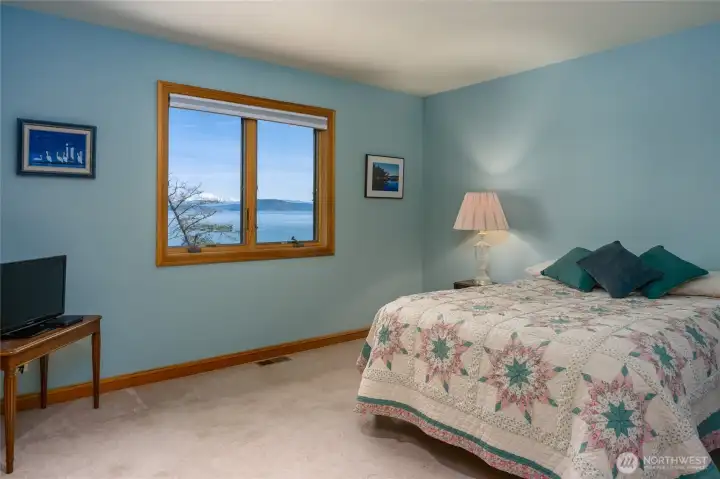 Upstairs bedroom with marine and mountain views.  Guests staying here won't want to leave.