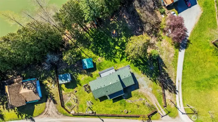 Fenced property along the front, and high bank to the rear for privacy.