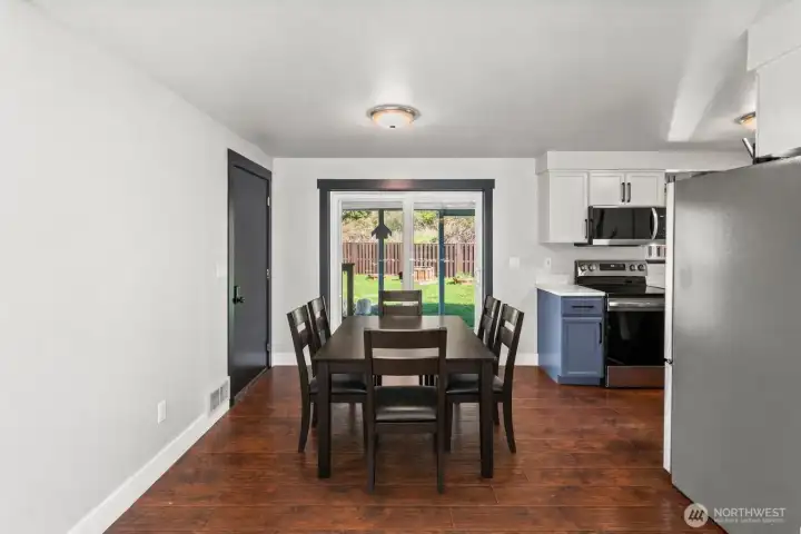 Dining room off kitchen. *Virtual staging* Dining room off kitchen. *Virtual staging*