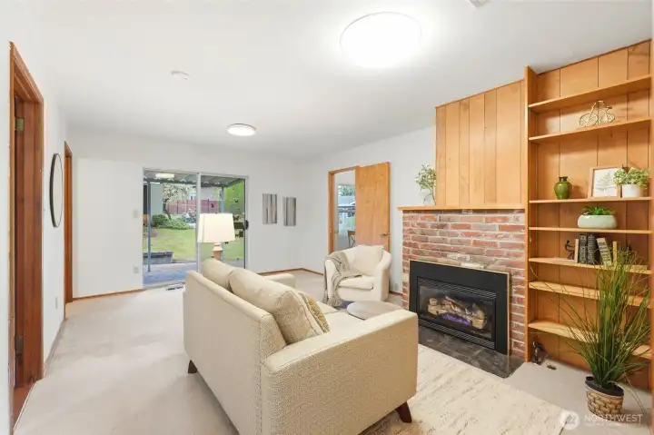 The primary suite wing has its own living room with gas fireplace.