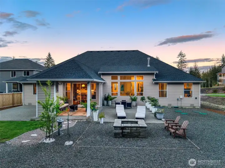 Evenings are meant to be spent here, fire glowing, doors open, and a seamless blend of indoor comfort and outdoor living that invites you to relax, gather, and stay awhile.