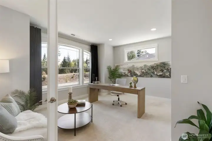 Just across from the dining room, this light-filled den offers a quiet place to focus or unwind, bright, versatile, and perfectly positioned for the way you live