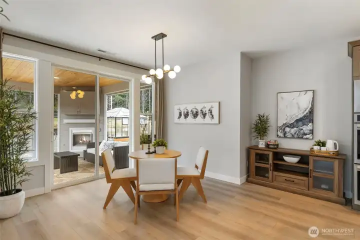 An oversized breakfast nook designed for real living, plenty of room to gather, linger, and stay connected, with an easy flow to the outdoor space beyond.