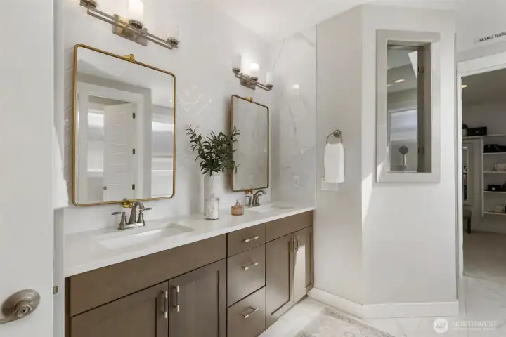 Start and end your day with ease in a beautifully designed primary bath featuring a custom dual vanity, offering both space and style for a calm, everyday routine.